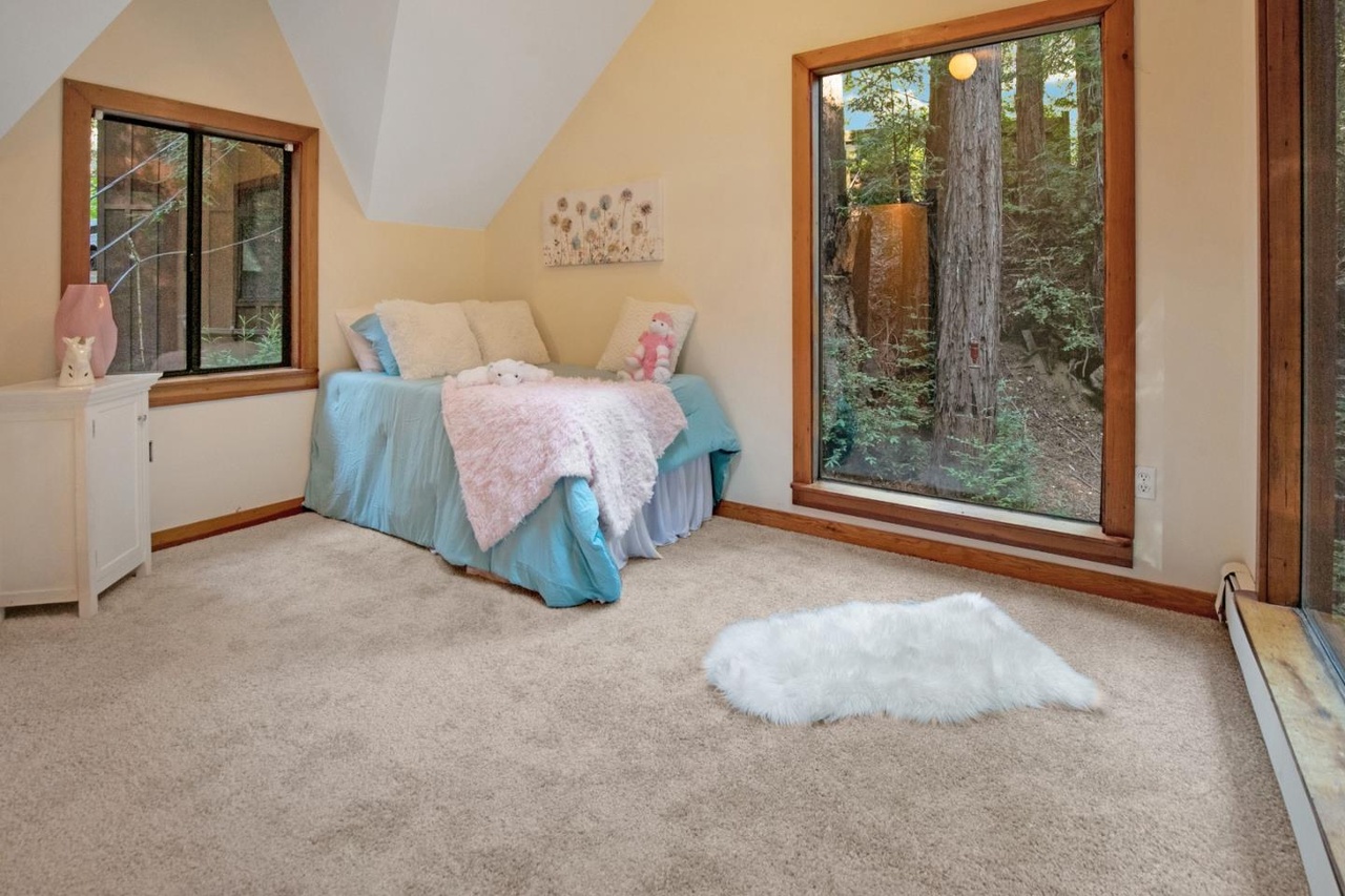 Sunny third bedroom with skylight and views.