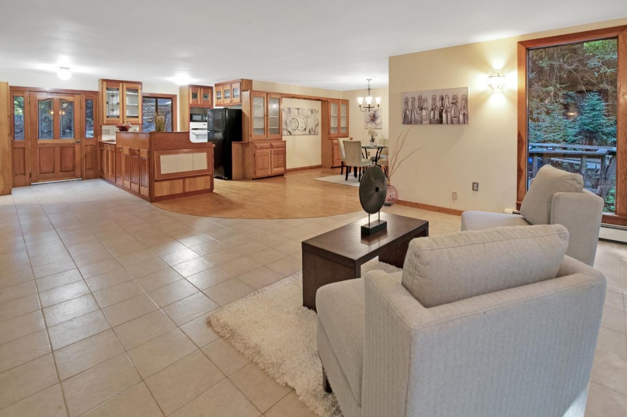 Living room spans the width—great light and tall ceilings.