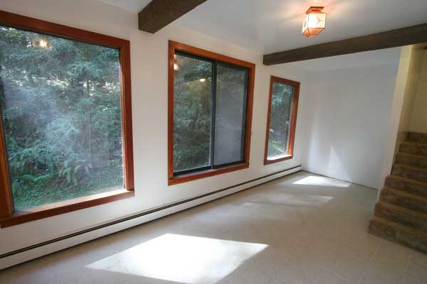 Tile floor; steps up to living room.