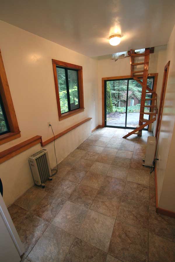 The lower floor as viewed from the kitchen,  with the Bathroom to the right.