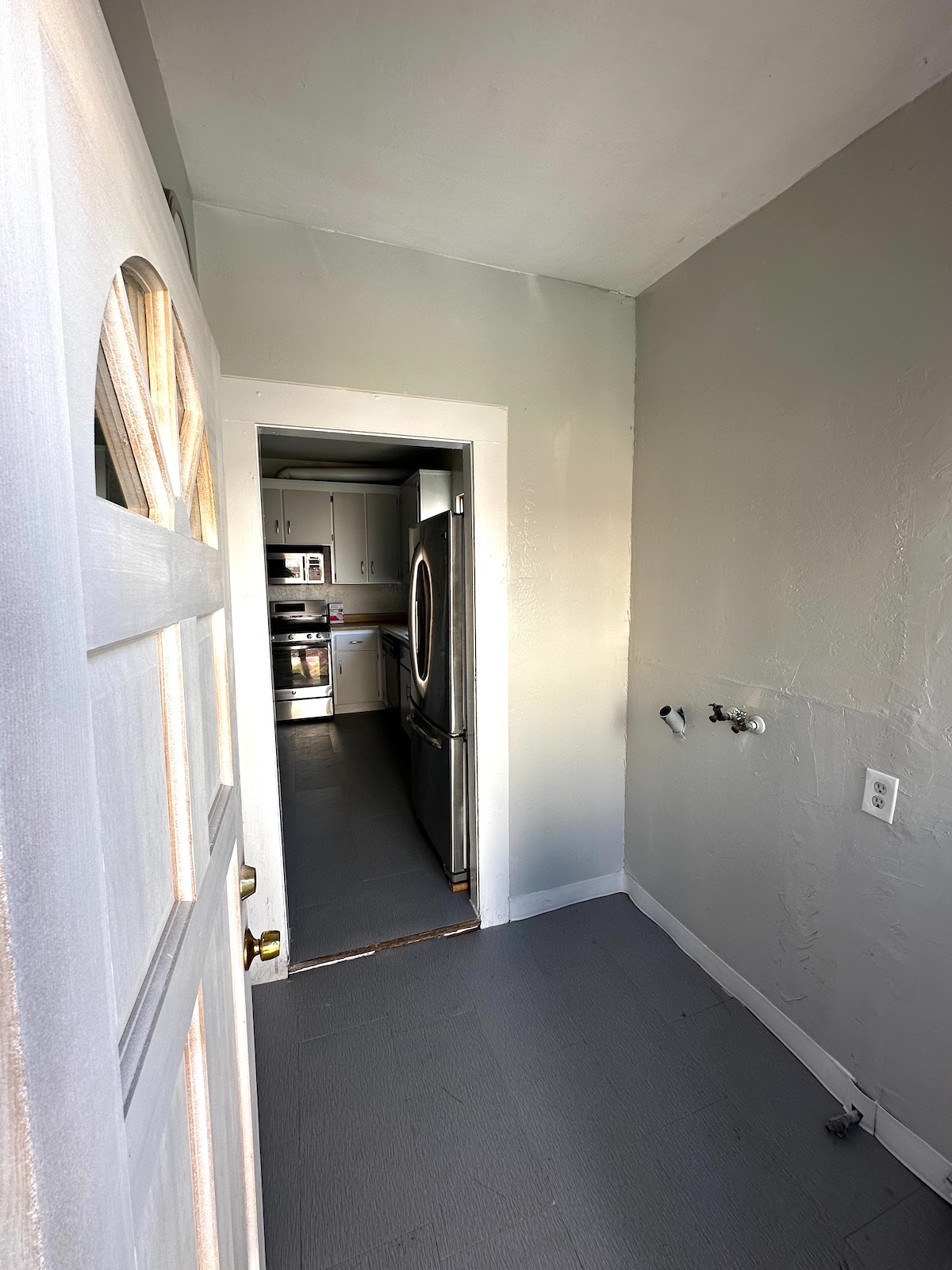 Laundry room with gas dryer hookups; yard access