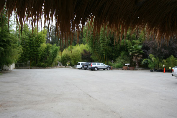 Front outlook and covered parking for one car.