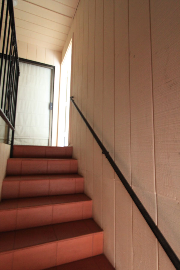 Up the stairs; first door on the left.